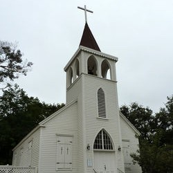 Old Saint Raymond's Church, a white wooden church with a bell tower and steeple